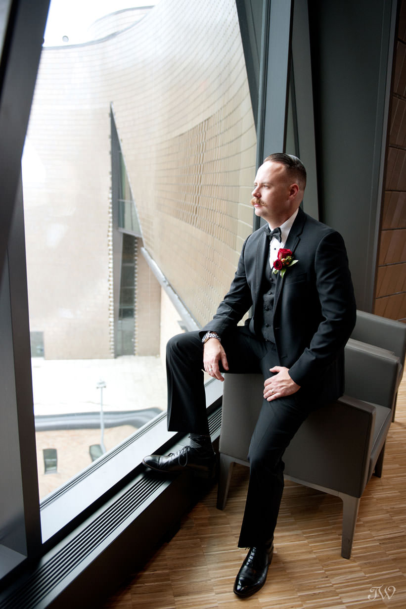 groom at the National Music Centre captured by Calgary wedding photographer Tara Whittaker