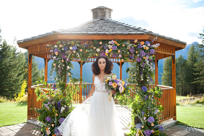 bride at the Silvertip wedding gazebo captured by Calgary wedding photographer Tara Whittaker