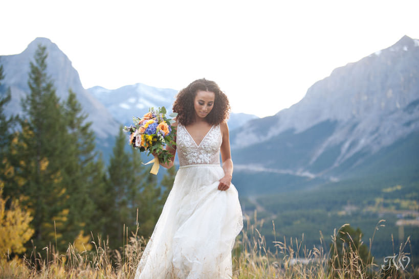 bride in the mountains at her Silvertip wedding captured by Calgary wedding photographer Tara Whittaker