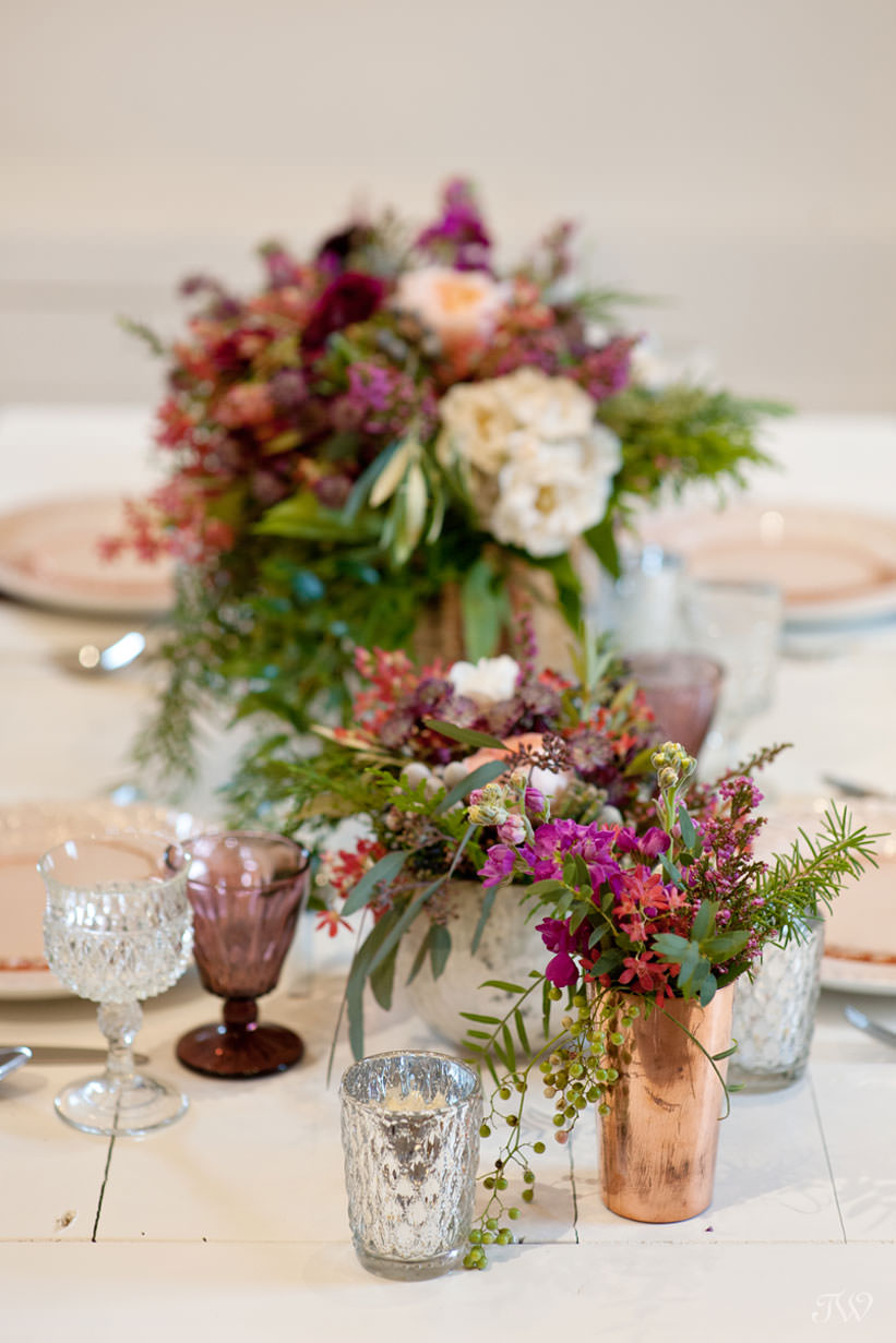 tabletop details in berry tones winter wedding inspiration captured by Calgary wedding photographer Tara Whittaker
