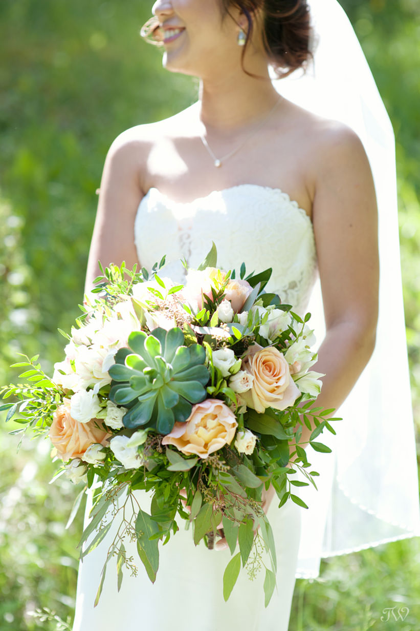 Summer bride carries succulents in this feature of best bridal bouquets by Tara Whittaker Photography