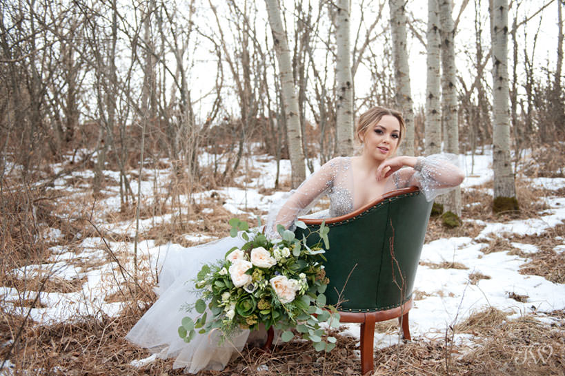 Winter Hayley Paige bride carries bouquet of greenery captured by Tara Whittaker Photography