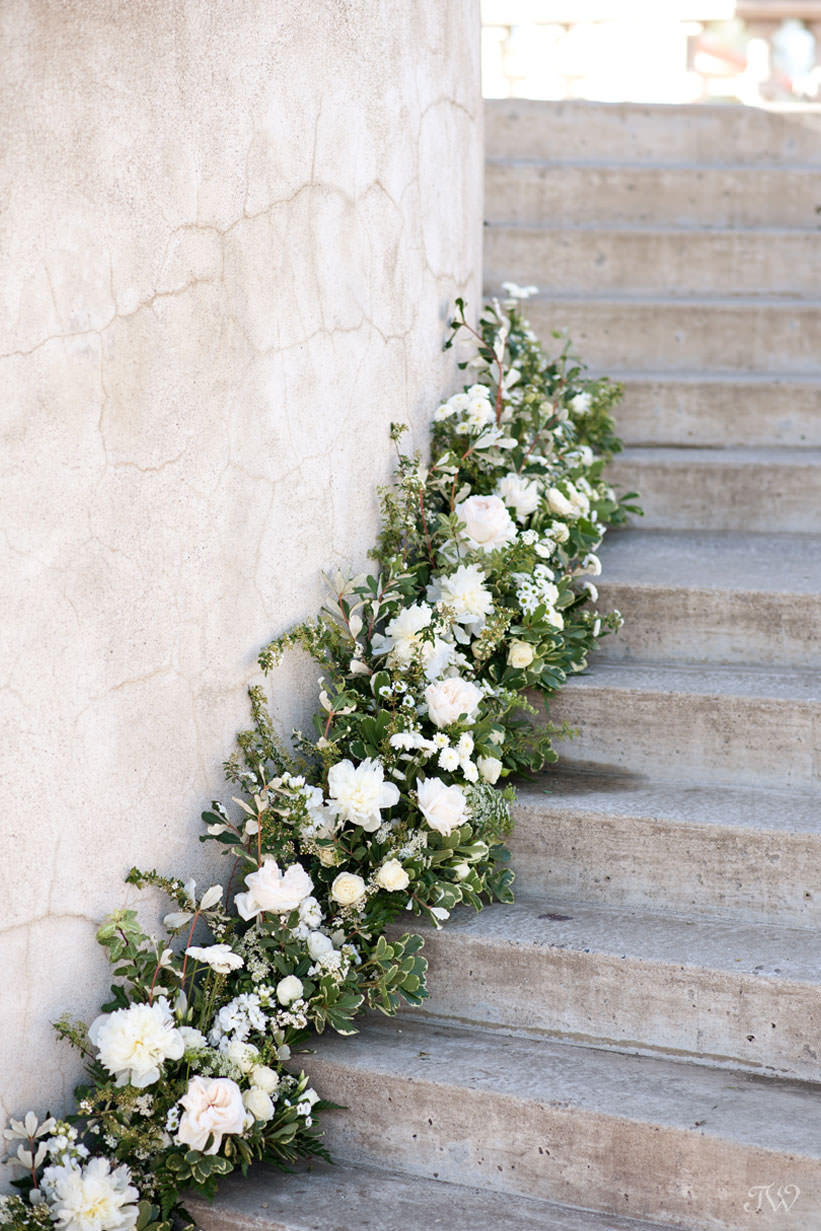 Floral treatment from Flowers by Janie on the Grand Staircase at Spruce Meadows captured by Tara Whittaker Photography