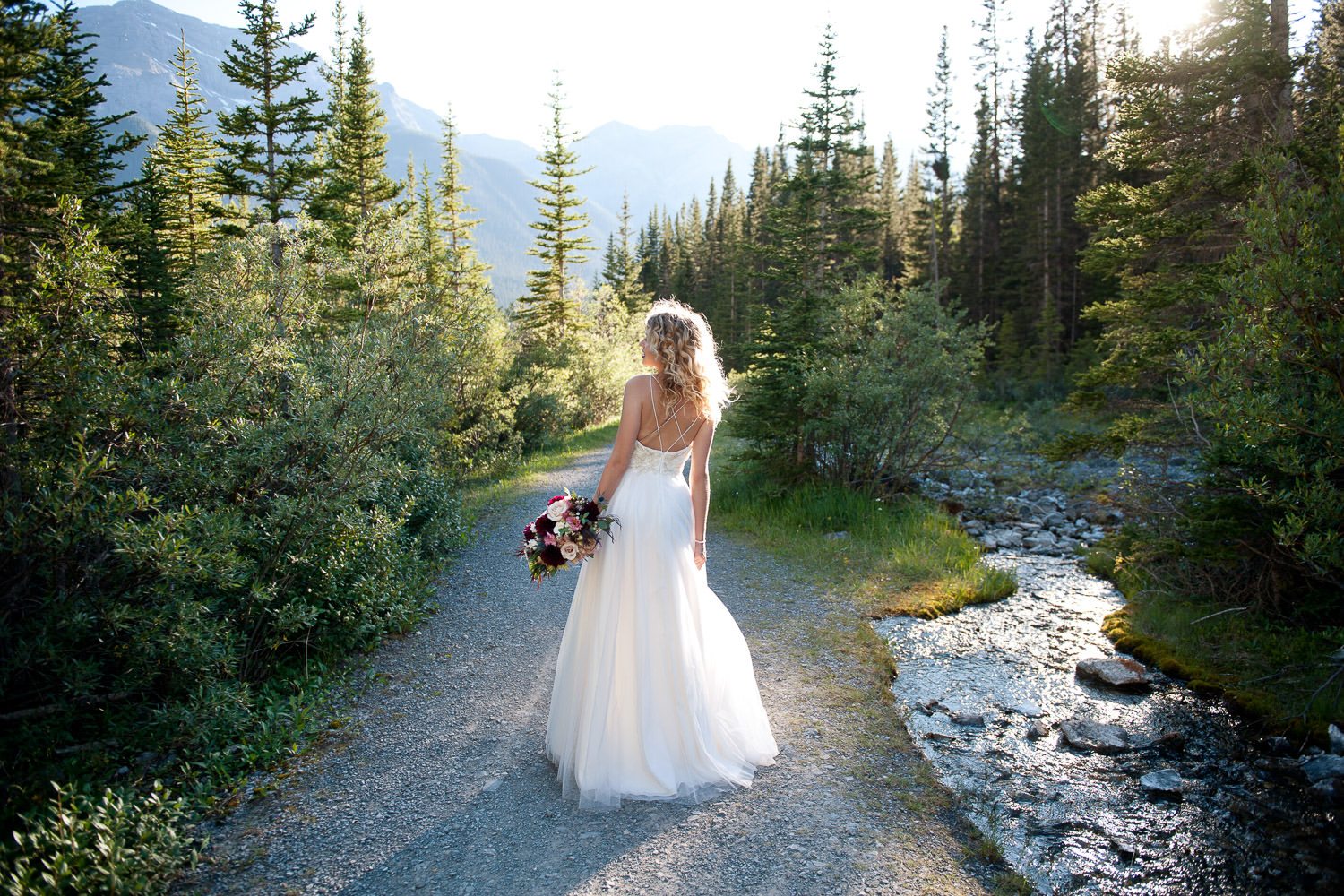 bride in the mountains near Canmore captured by Tara Whittaker Photography