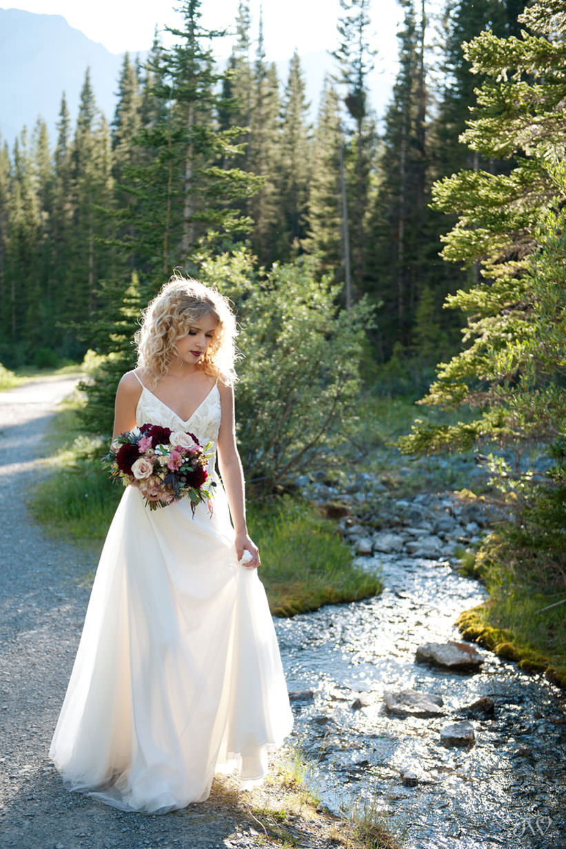 Bride during Canmore wedding photos at Goat Creek captured by Tara Whittaker Photography