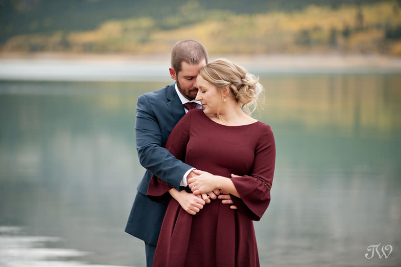 bride and groom during their barrier lake engagement session captured by Tara Whittaker Photography