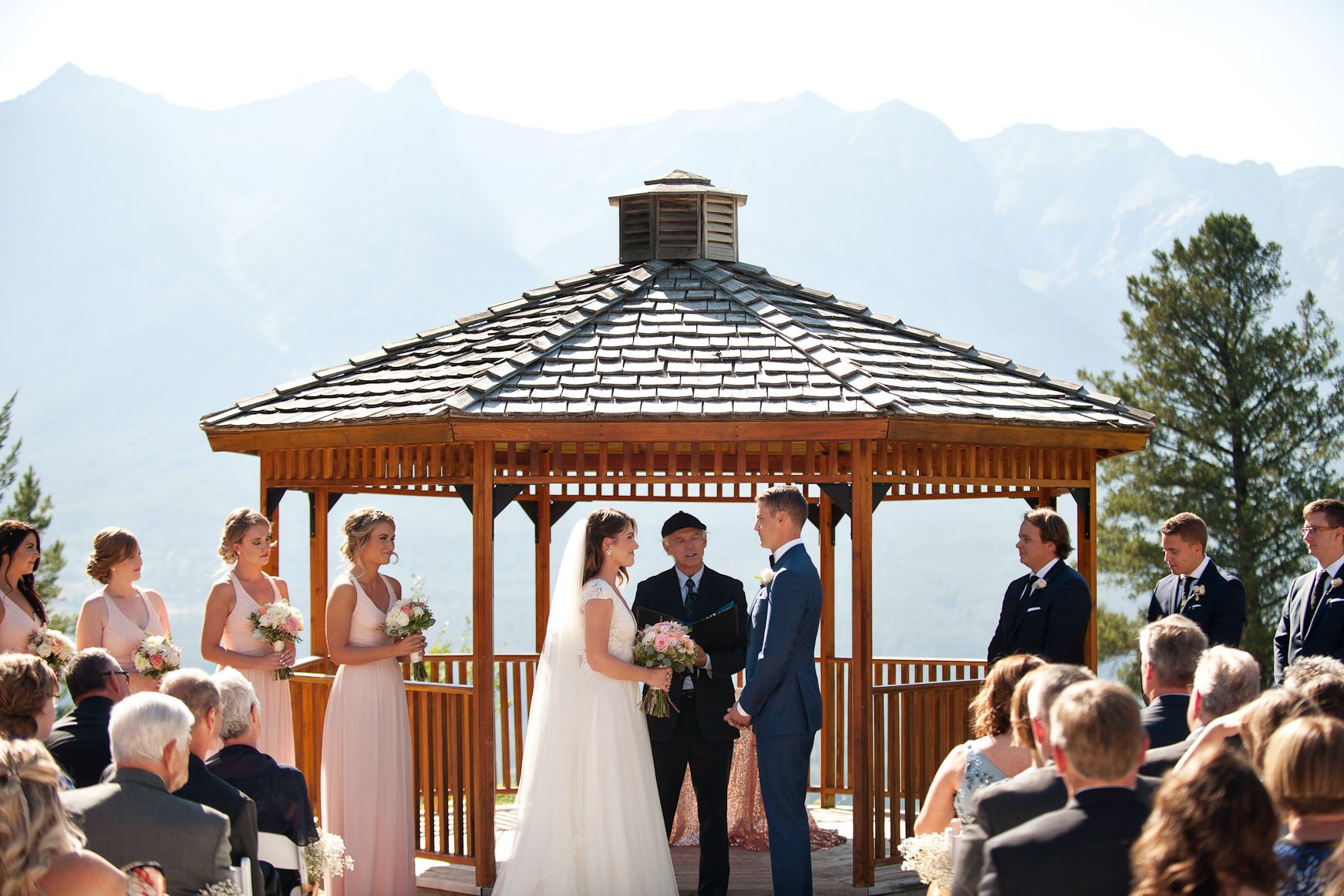 bride and groom exchanging vows at their Silvertip Resort wedding