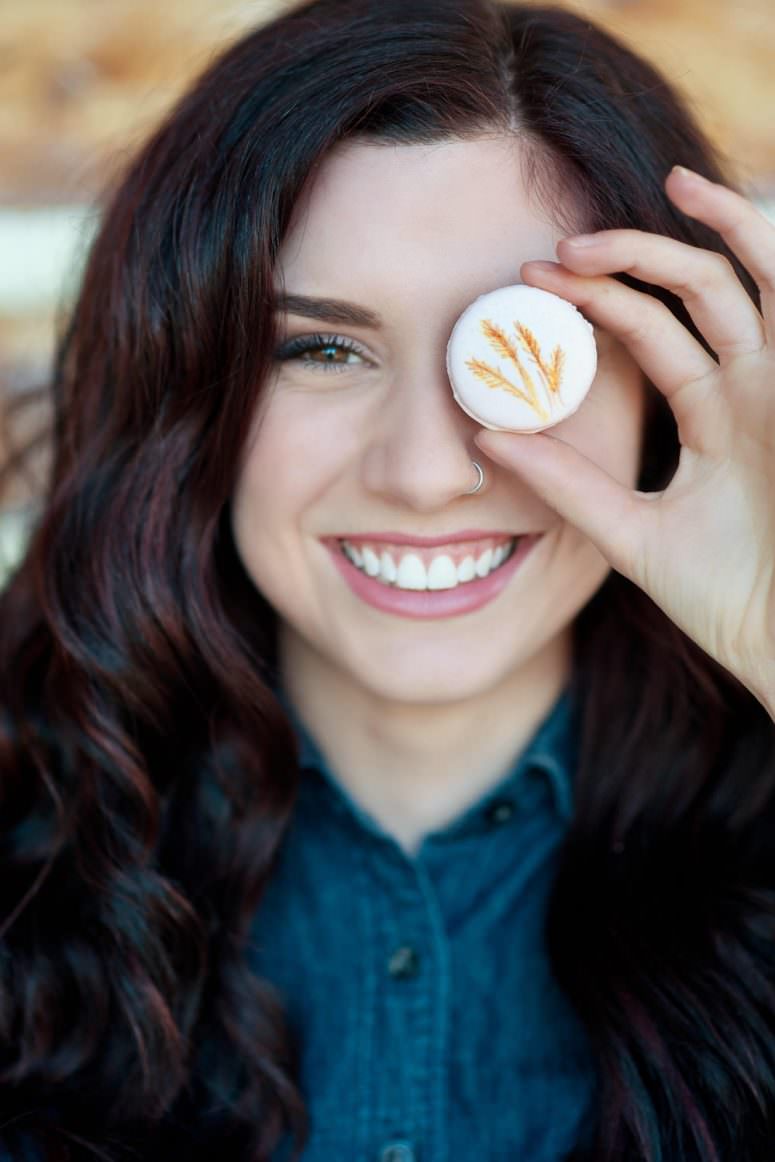 stampede partygoer holding macaron Calgary wedding portfolio Tara Whittaker