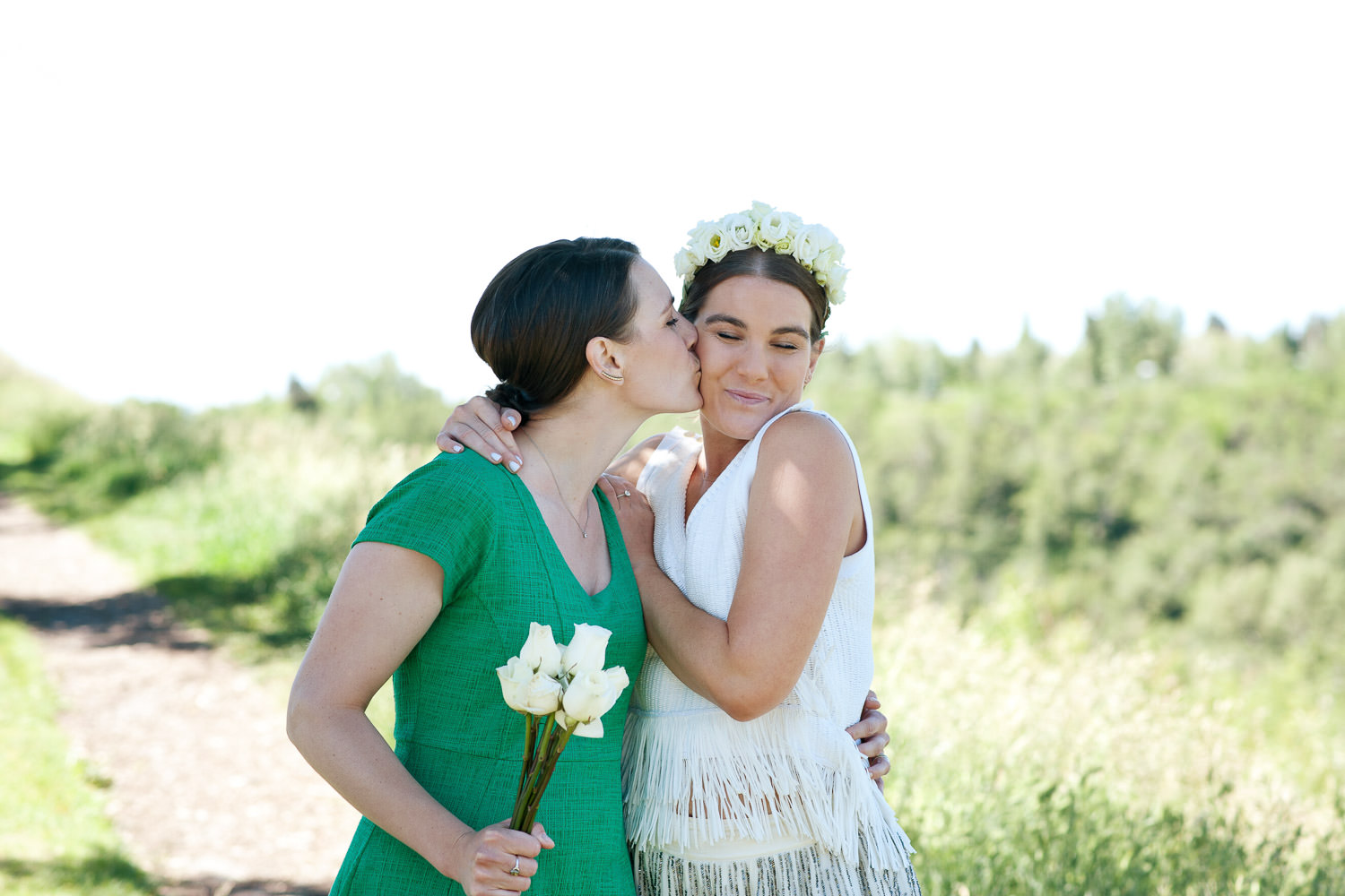 bride poses with her sister captured by Tara Whittaker Photography
