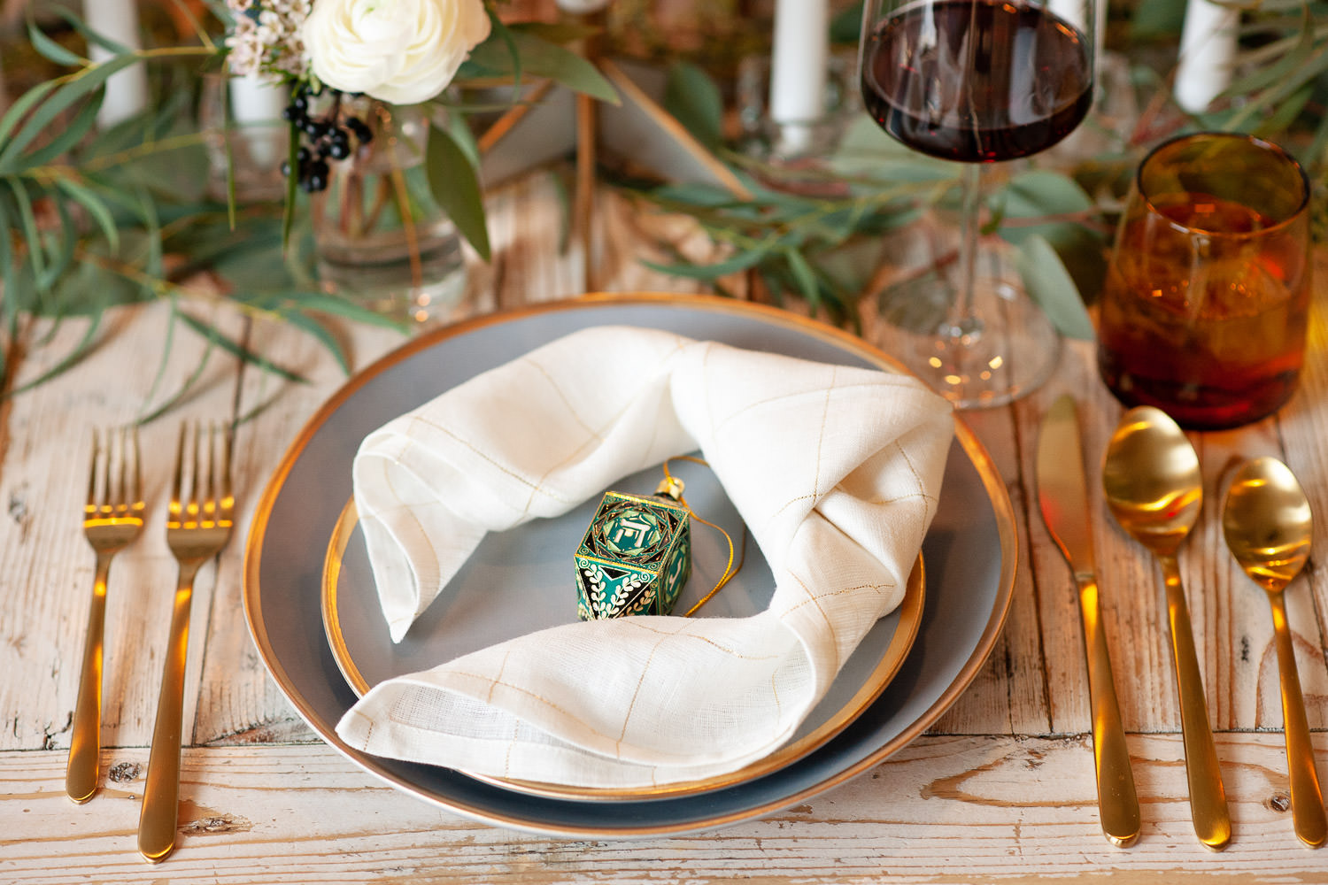 Gold-rimmed table settiing from Crate & Barrel captured by Calgary wedding photographer Tara Whittaker