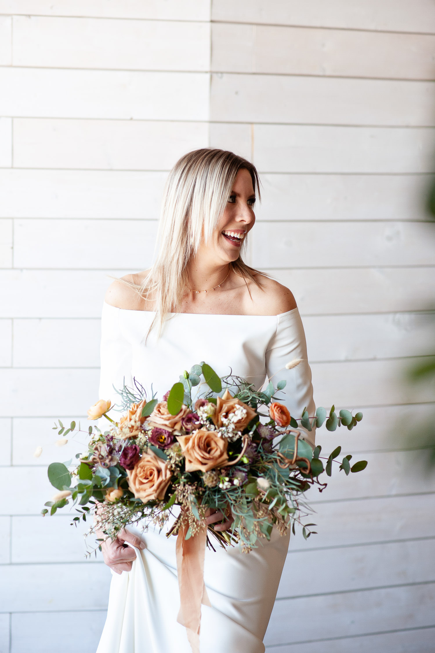 Brides carries a bouquet by Sweet Bloom at her Annex Ale Project Wedding captured by Tara Whittaker Photography