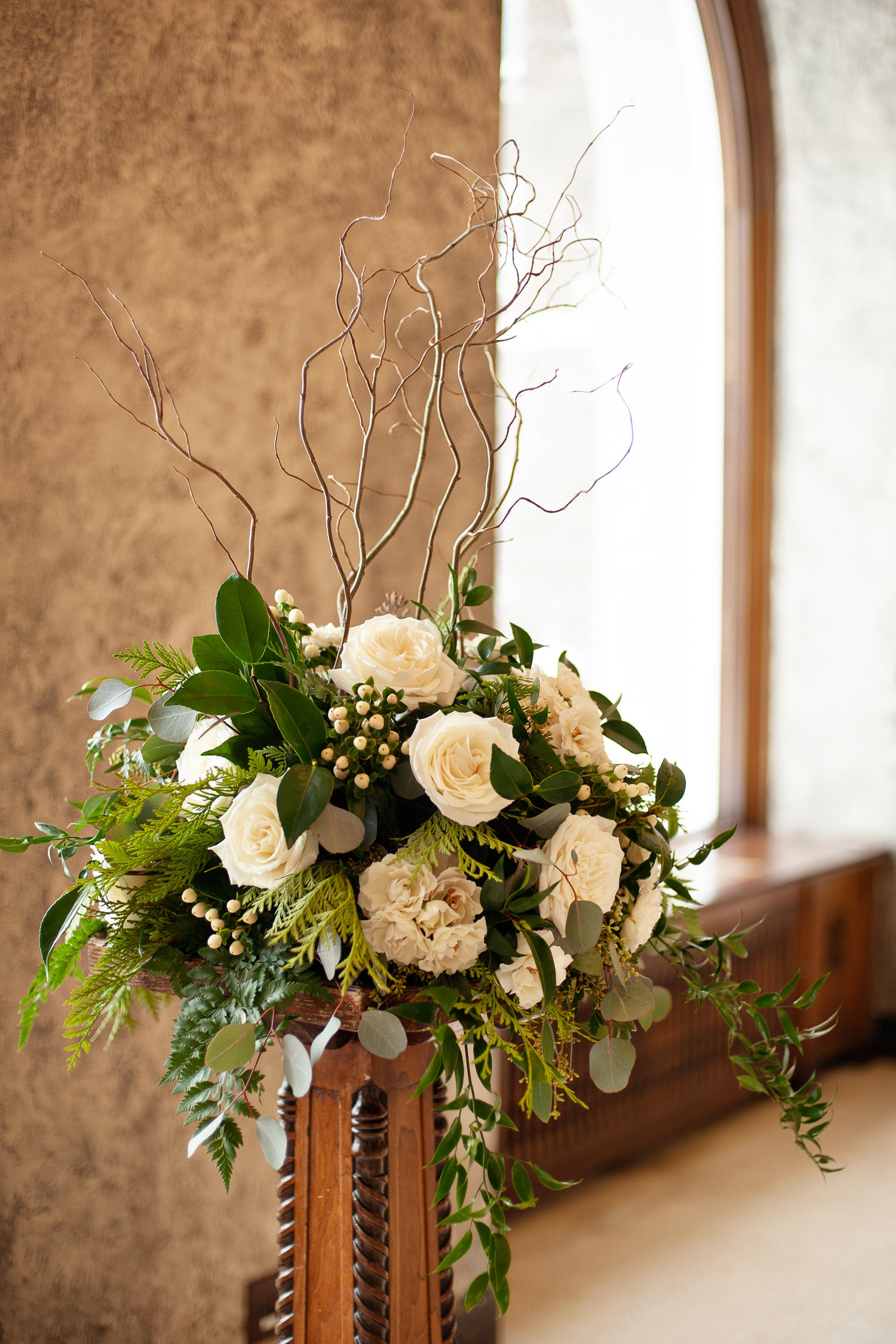 Ceremony florals in the Riverview Lounge at the Fairmont Banff Springs captured by Tara Whittaker Photography