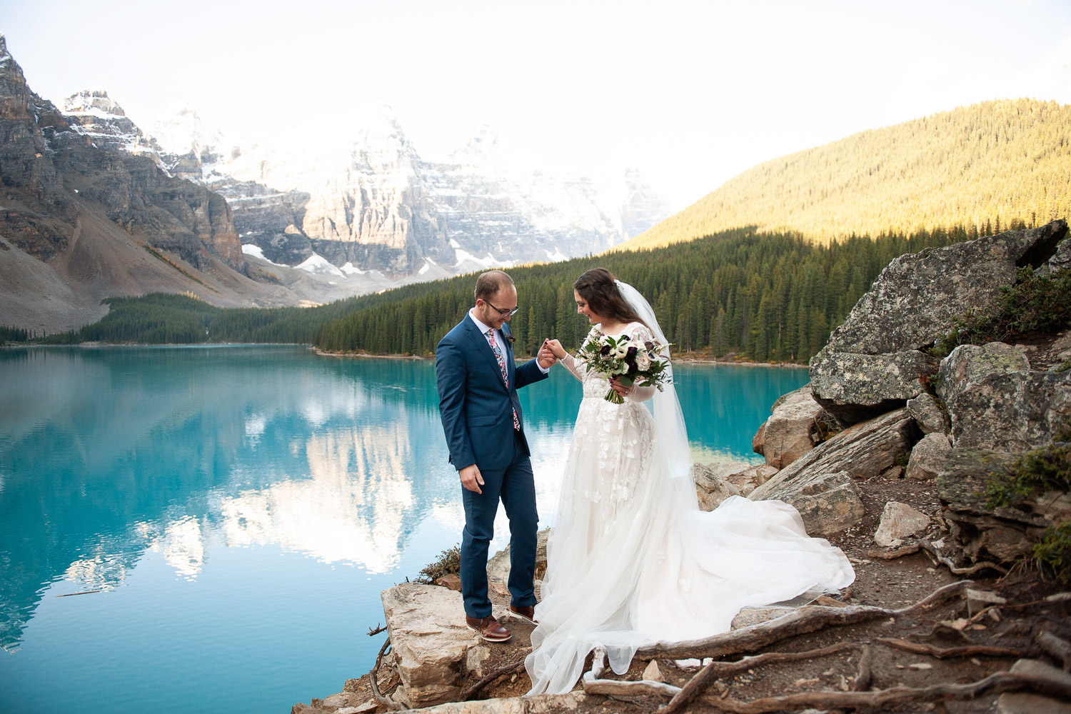 Bride and groom at Moraine Lake captured by Tara Whittaker Photography