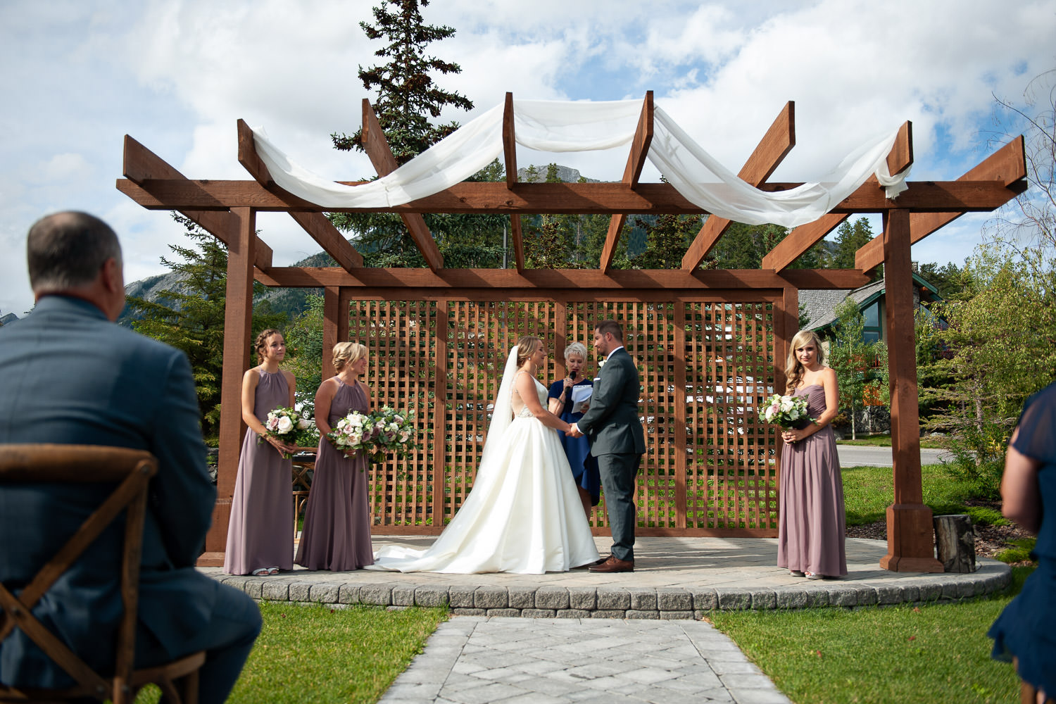 Wedding ceremony at Creekside Villas in Canmore captured by Tara Whittaker Photography