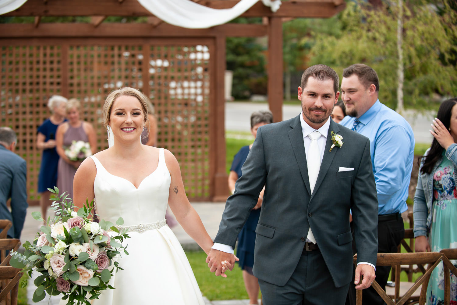 Happy bride and groom after their Creekside Villa wedding captured by Tara Whittaker Photography
