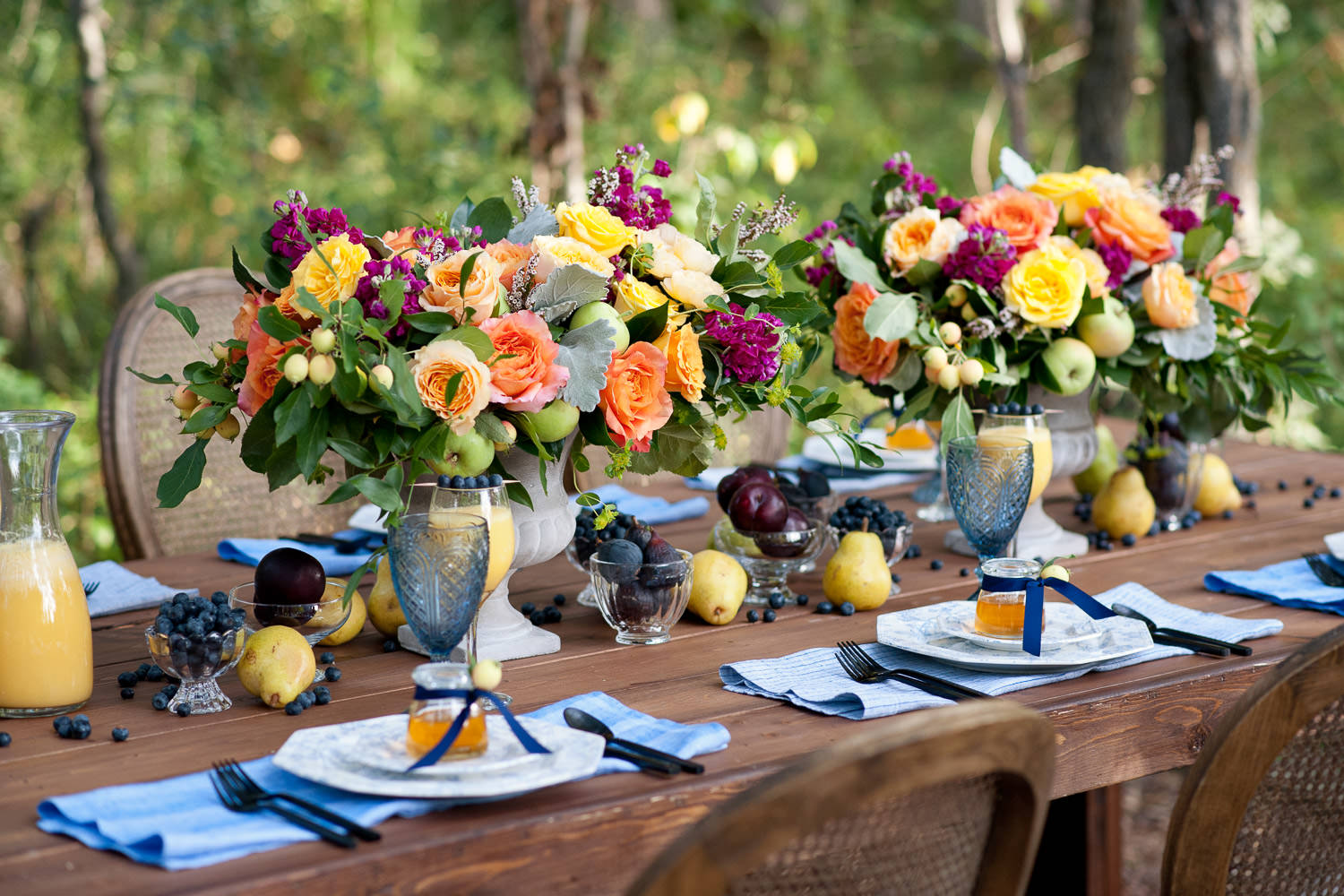 harvest table dressed with flowers and fruit captured by Tara Whittaker Photography