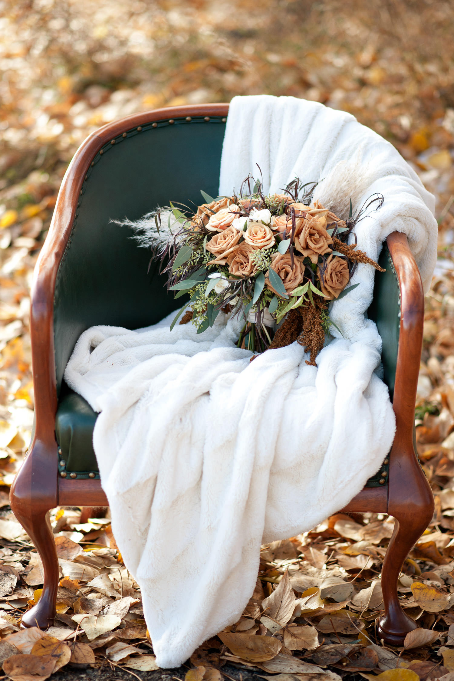 fall bouquet sits among the leaves captured by Tara Whittaker Photography