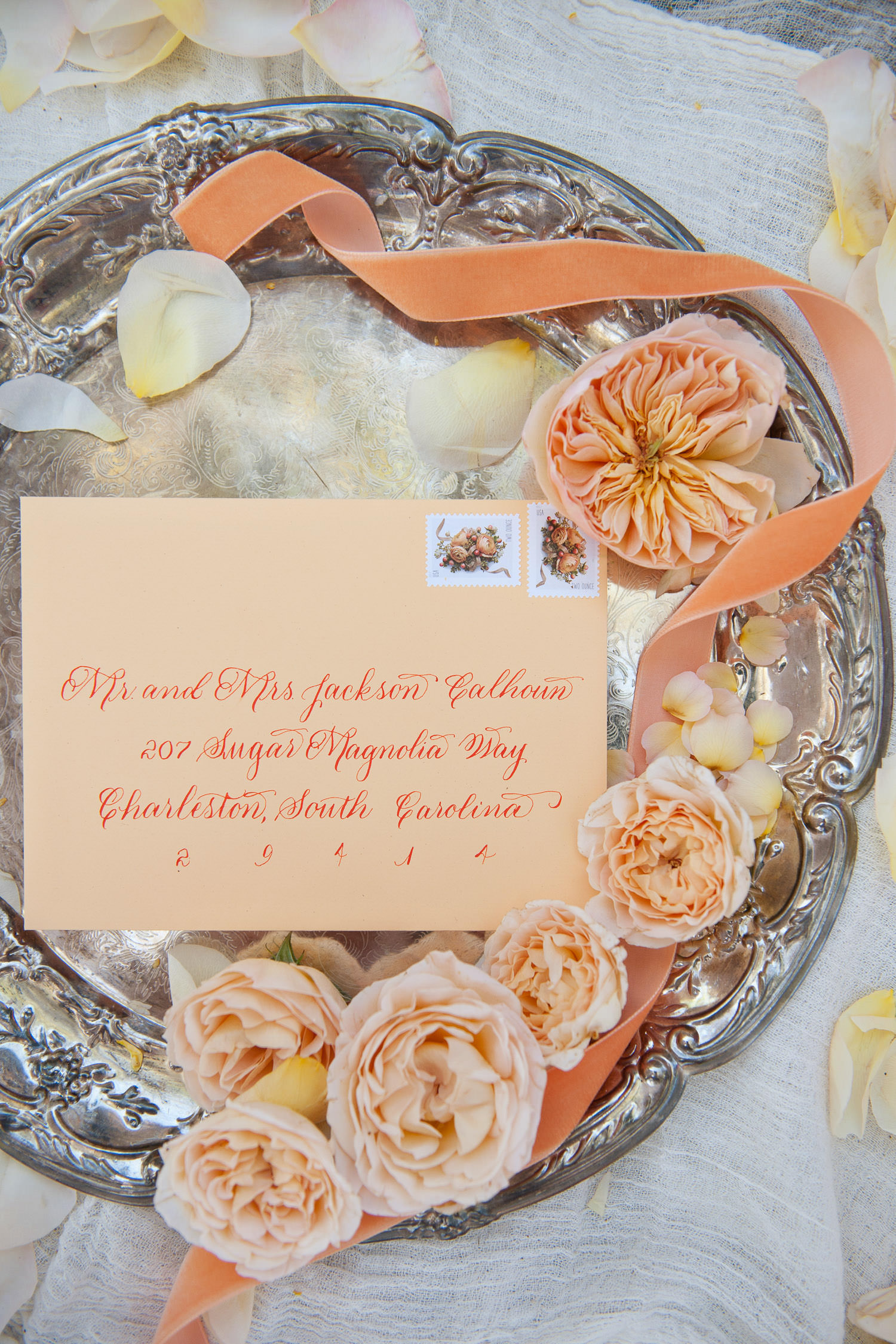 Wedding invitation styled with garden roses captured by Tara Whittaker Photography