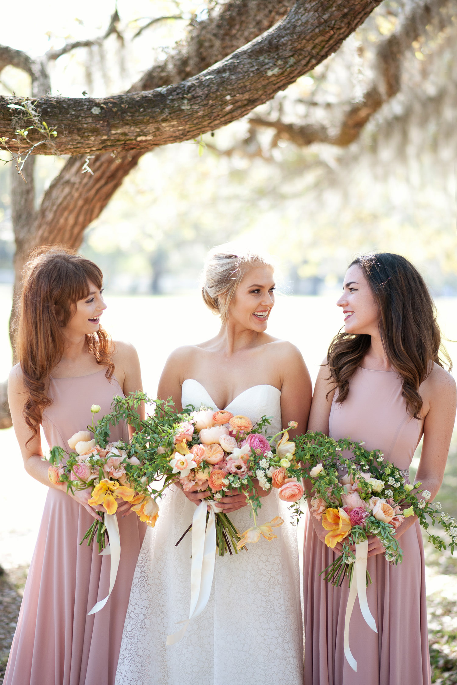 bride with her bridesmaids captured by Tara Whittaker Photography