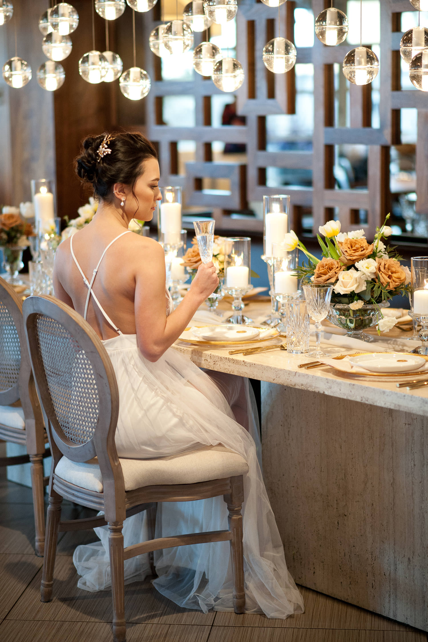bride sits at the head table at Alloy restaurant captured by Tara Whittaker Photography