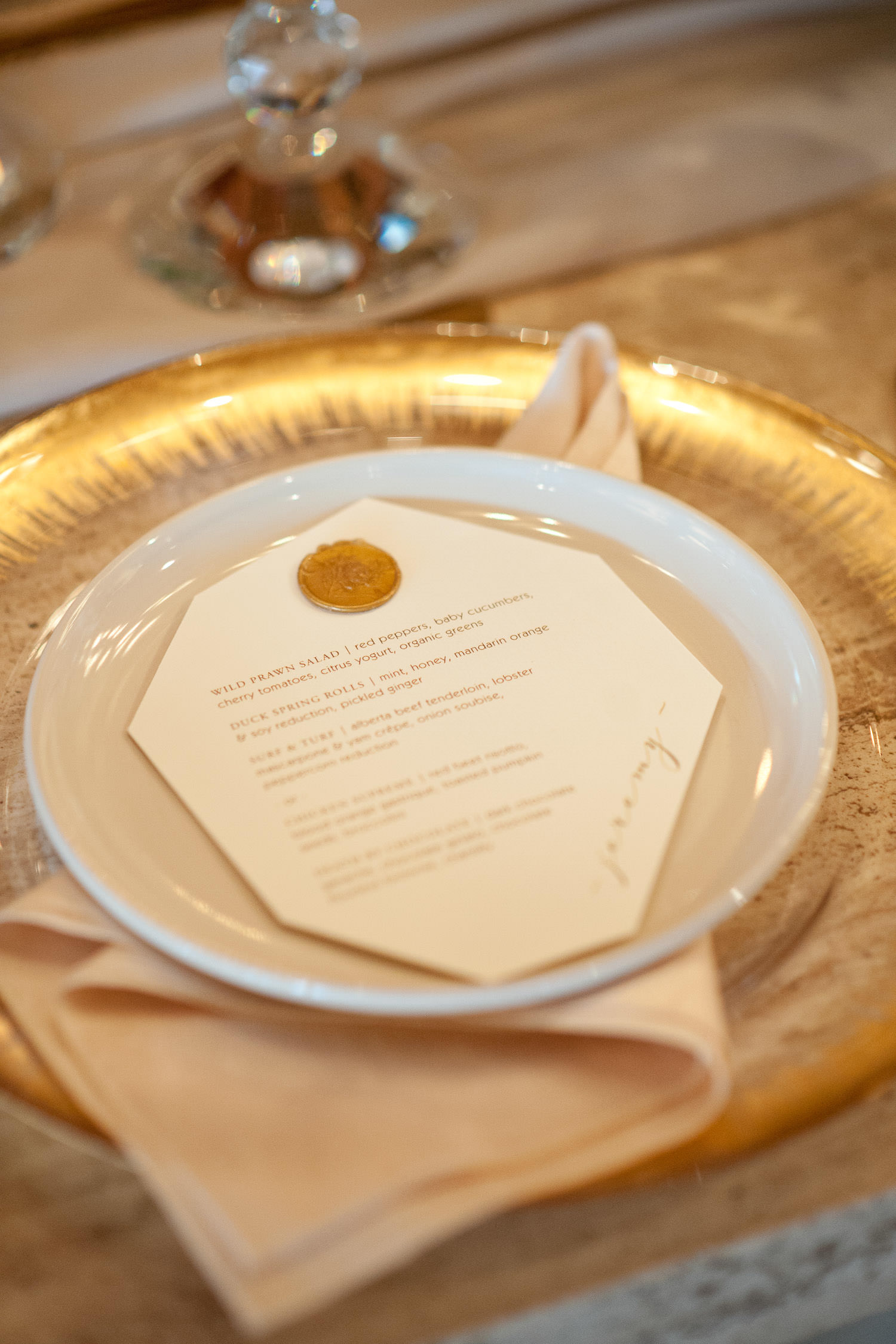 Wedding menu with a wax seal captured by Tara Whittaker Photography
