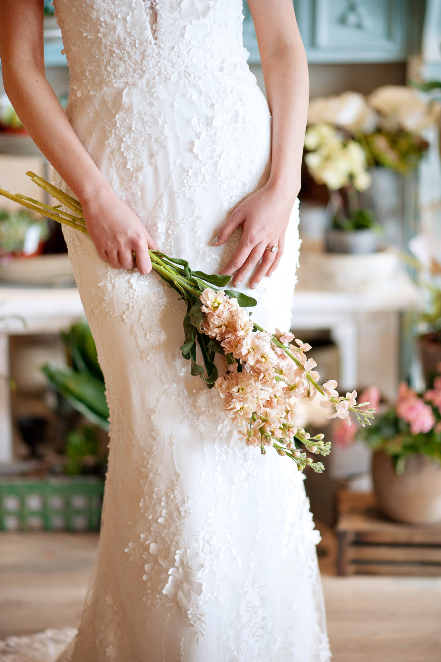 Close-up of the floral lace on bride's Lis Simon bridal gown captured by Tara Whittaker Photography