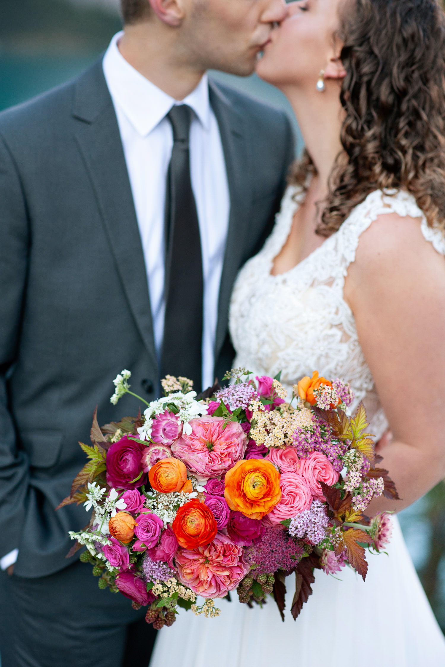 Moraine Lake bride carries a pink bouquet captured by Tara Whittaker Photography