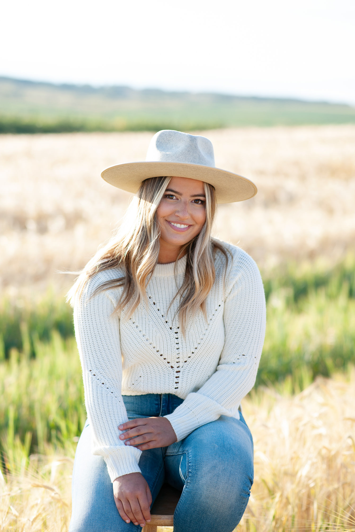 Bride wears a cozy sweater and hat for fall engagement session captured by Tara Whittaker Photography