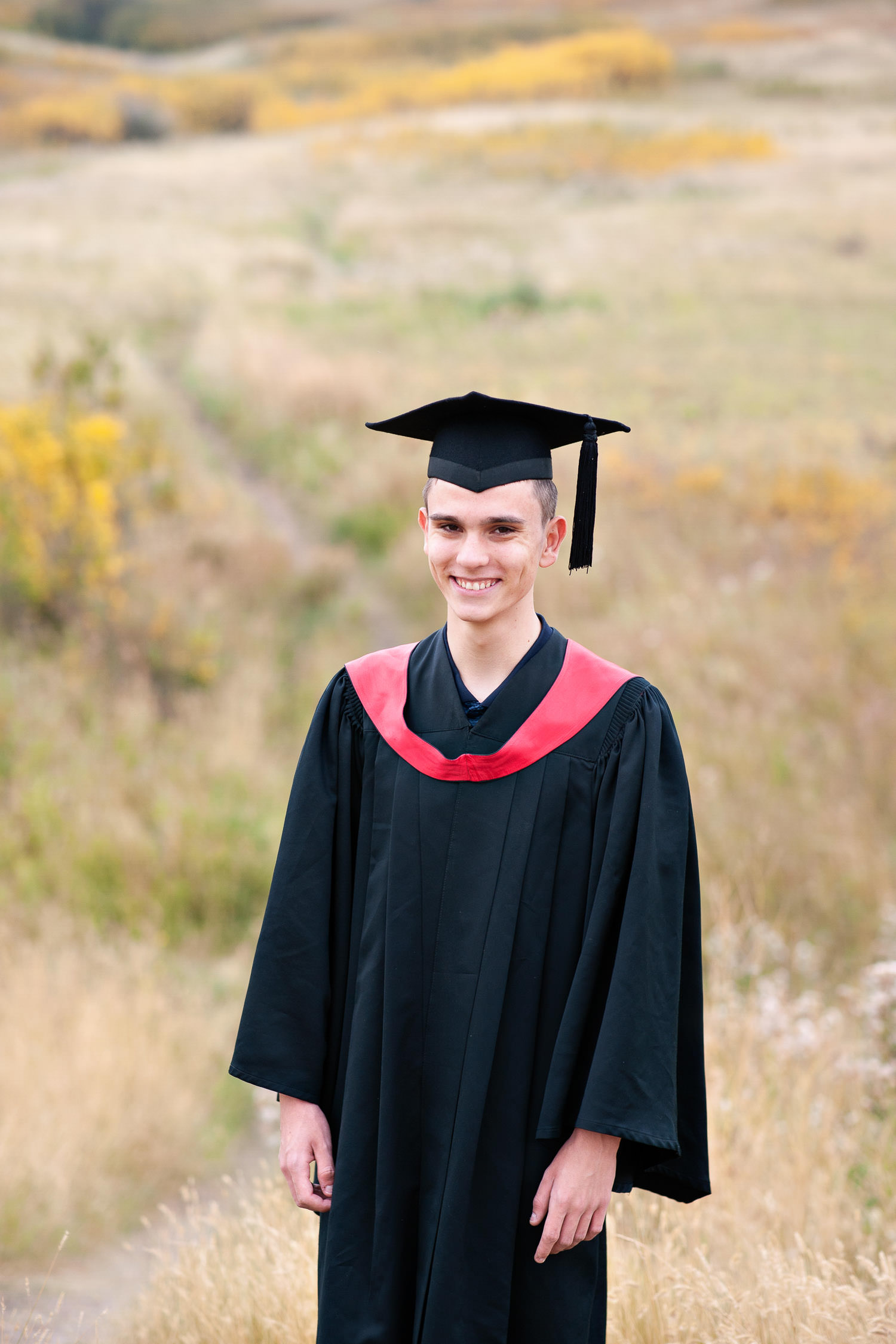 Calgary grad in cap and gown captured by Calgary photographer Tara Whittaker