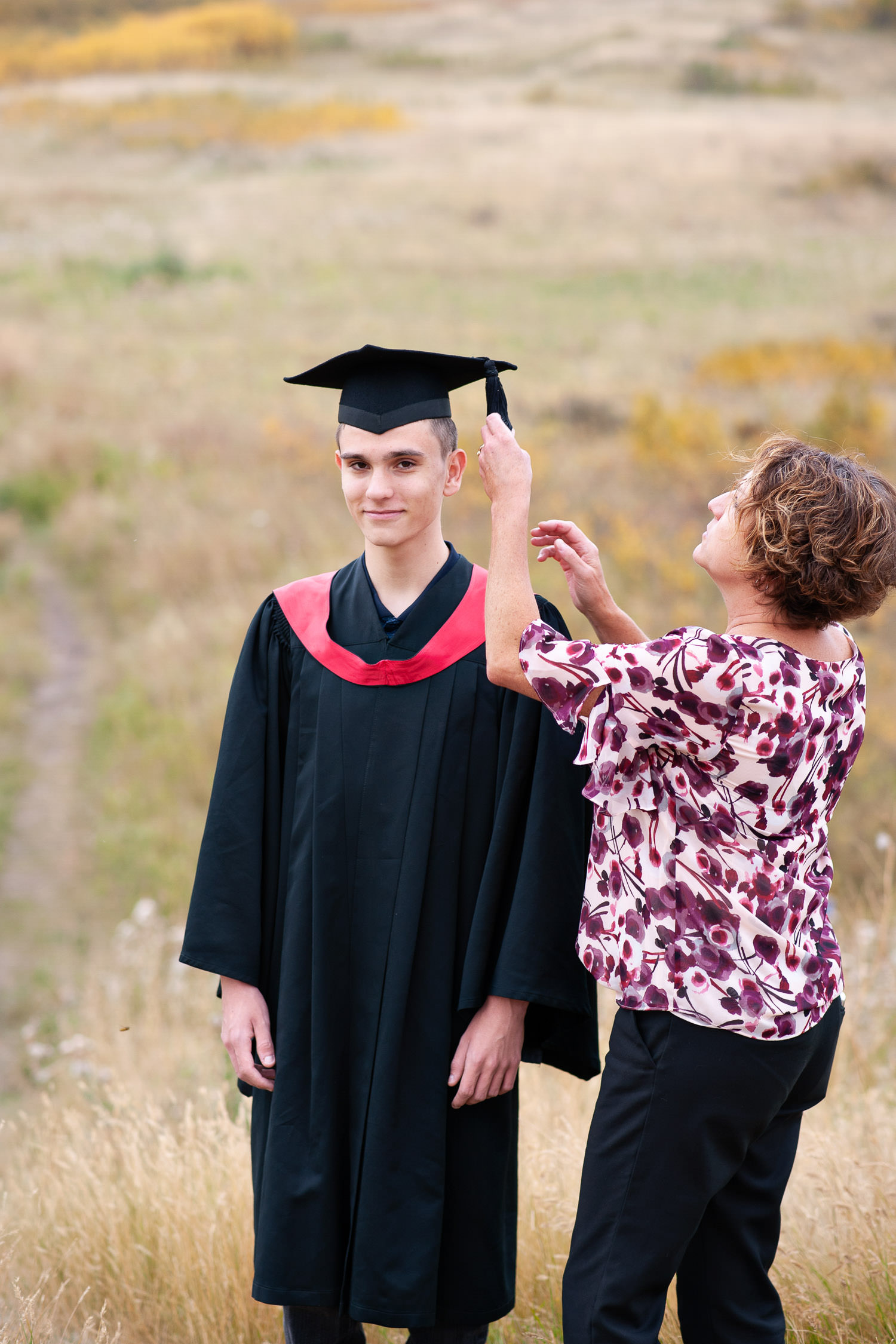Calgary graduate with his Mom captured by Tara Whittaker Photography