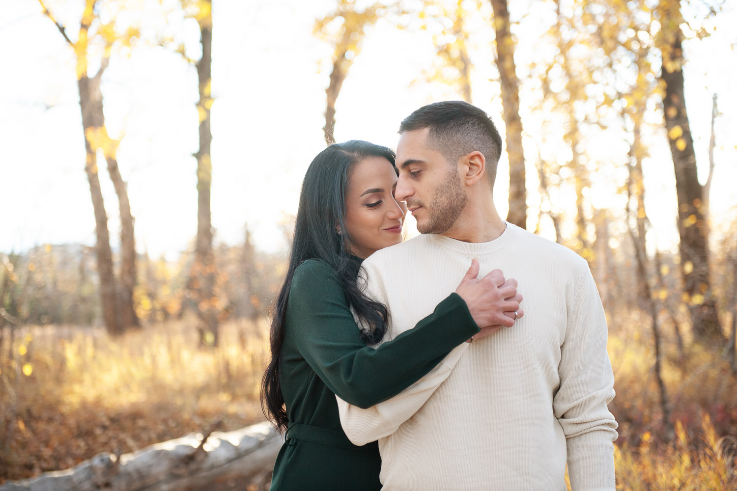 bride and groom during autumn engagement session captured by Calgary wedding photographer Tara Whittaker
